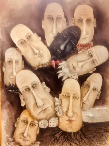 Grup de chipuri alungite, ca niște măști, unul dintre ele negru